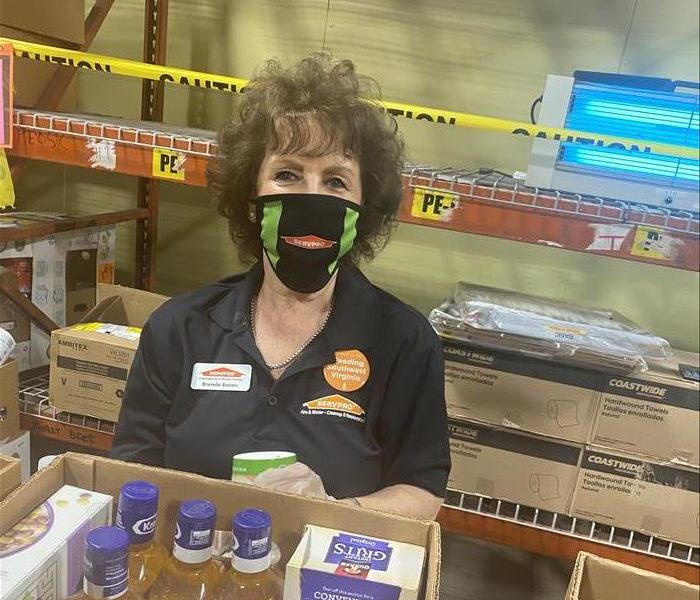 Woman with SERVPRO mask on